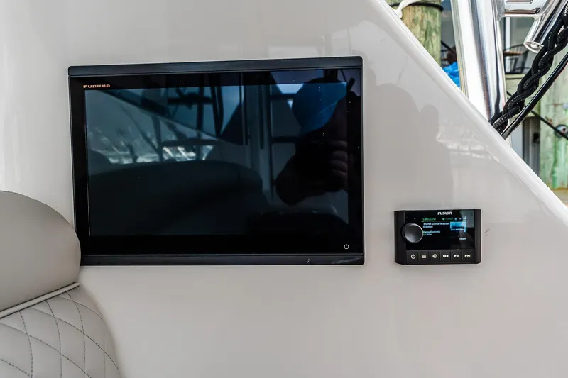 Slide: The Image of Control panel and display on 2025 Viking 64 Convertible yacht. - 39