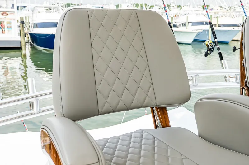 Slide: The Image of Luxury seating on 2025 Viking 64 Convertible yacht, featuring diamond-stitched upholstery. - 48