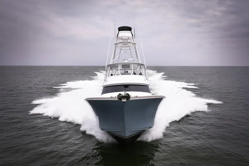 Slide: The Image of 2026 Viking 64 Convertible yacht cruising on open water. - 5