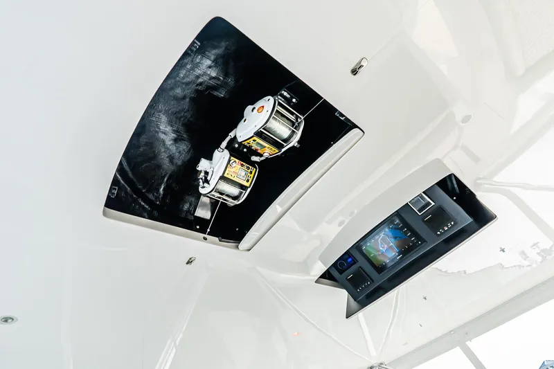 Slide: The Image of Ceiling view of 2025 Viking 64 Convertible yacht with advanced control panel and equipment. - 51