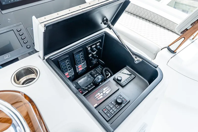 Slide: The Image of Control panel of 2025 Viking 64 Convertible yacht, featuring advanced navigation and communication systems. - 58