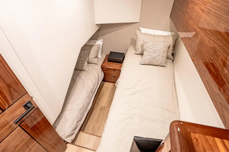 Slide: The Image of Luxurious twin cabin interior of 2026 Viking 64 Convertible yacht. - 79