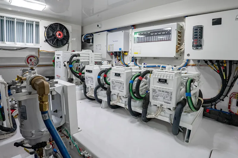 Slide: The Image of Engine room of 2026 Viking 64 Convertible yacht with advanced equipment and wiring. - 83