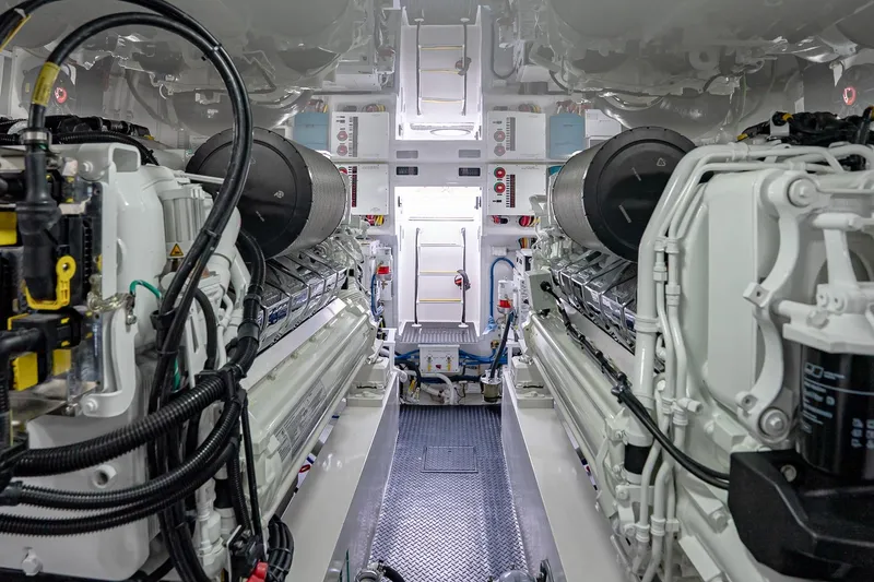 Slide: The Image of Engine room of 2026 Viking 64 Convertible yacht, showcasing advanced machinery and equipment. - 85