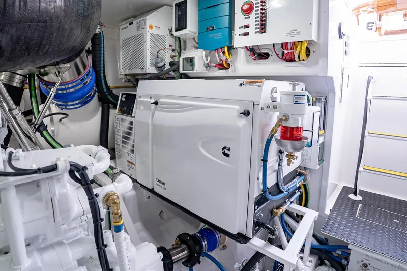 Slide: The Image of Engine room of 2026 Viking 64 Convertible yacht with Onan generator and advanced systems. - 86