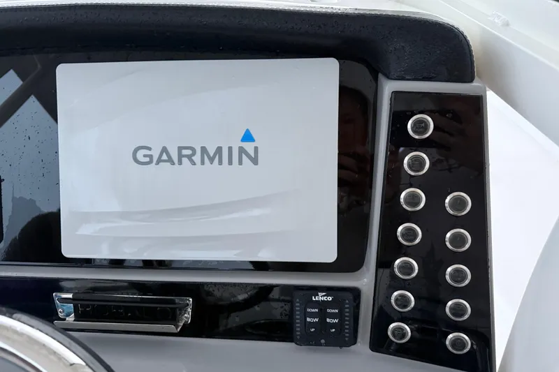 Slide: The Image of Garmin display on 2020 Robalo R272 Center Console boat dashboard with control buttons. - 11