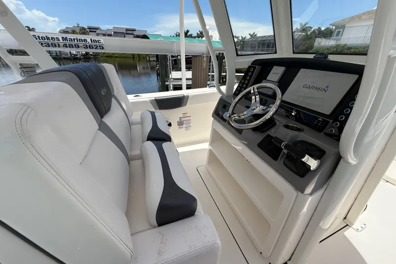 Slide: The Image of 2020 Robalo R272 Center Console boat interior with Garmin navigation system and comfortable seating. - 14