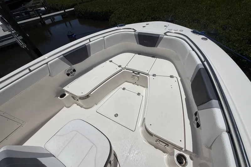 Slide: The Image of 2020 Robalo R272 Center Console boat interior with seating and storage compartments. - 18