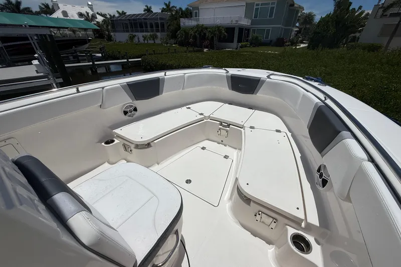 Slide: The Image of 2020 Robalo R272 Center Console boat interior with spacious seating and storage. - 20