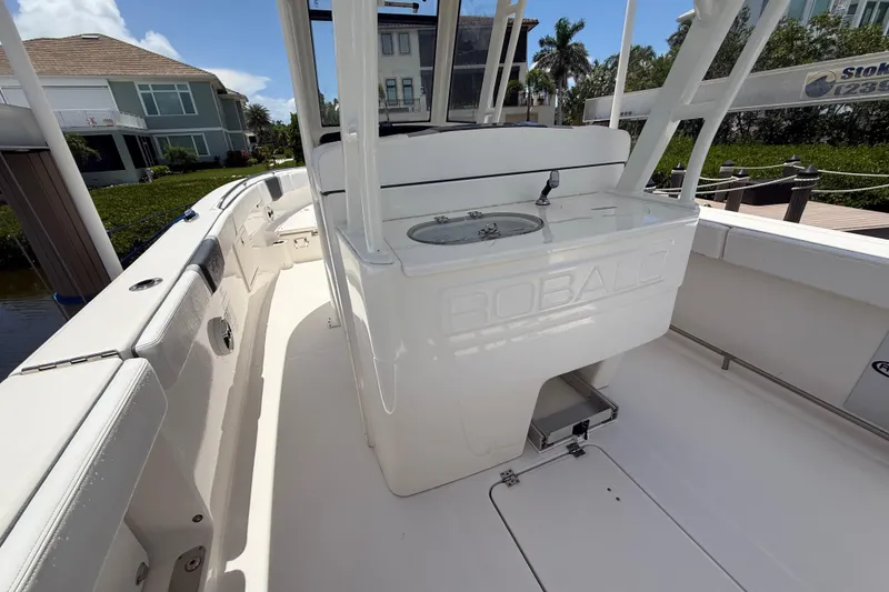 Slide: The Image of 2020 Robalo R272 Center Console boat interior with sleek white design and spacious layout. - 24
