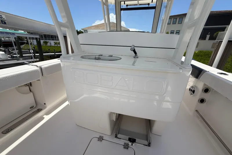 Slide: The Image of 2020 Robalo R272 Center Console boat interior with seating and storage. - 25