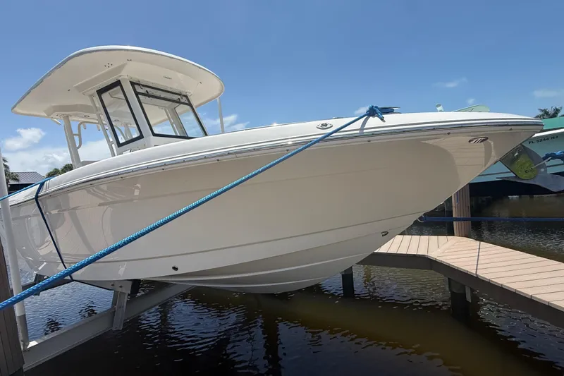 Slide: The Image of 2020 Robalo R272 Center Console boat docked on a sunny day. - 39
