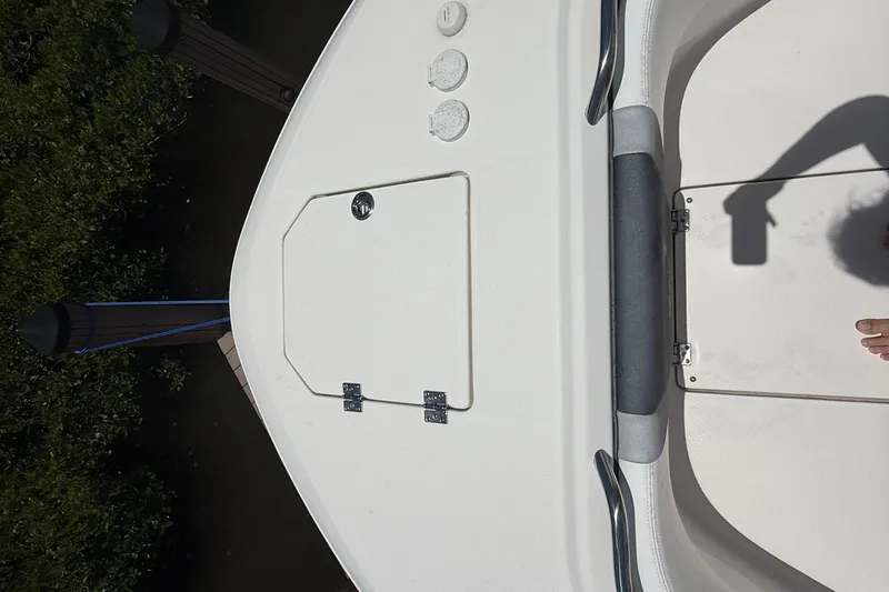 Slide: The Image of 2020 Robalo R272 Center Console boat deck with storage hatch and handrail. - 40