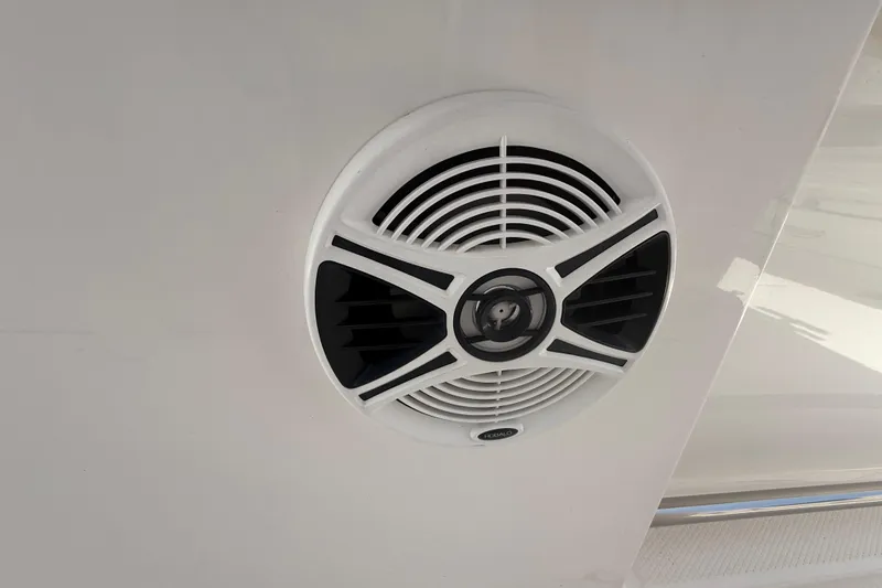Slide: The Image of 2020 Robalo R272 Center Console boat speaker, white and black design. - 42