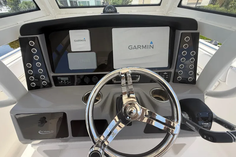Slide: The Image of 2020 Robalo R272 Center Console helm with Garmin navigation system and Yamaha controls. - 9