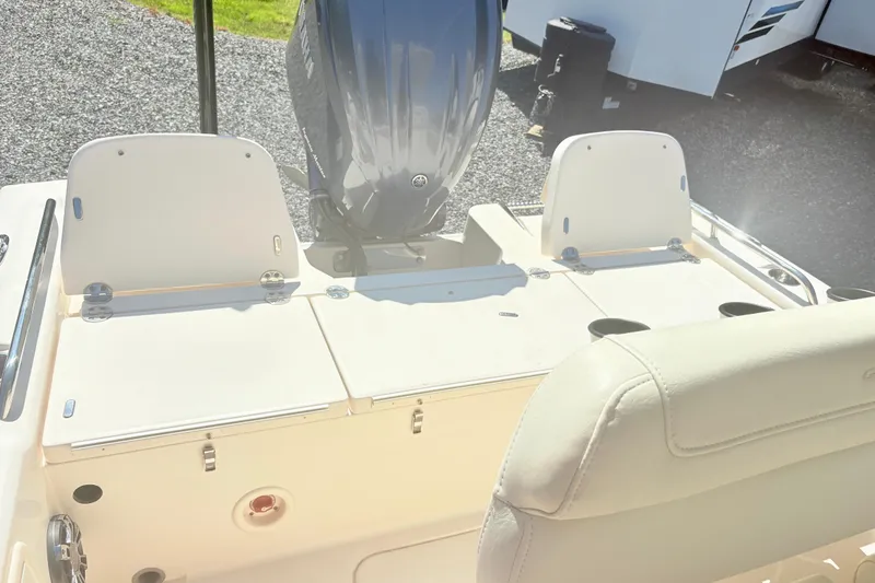 Slide: The Image of 2022 Grady-White 251 Coastal Explorer boat interior with engine and seating. - 12