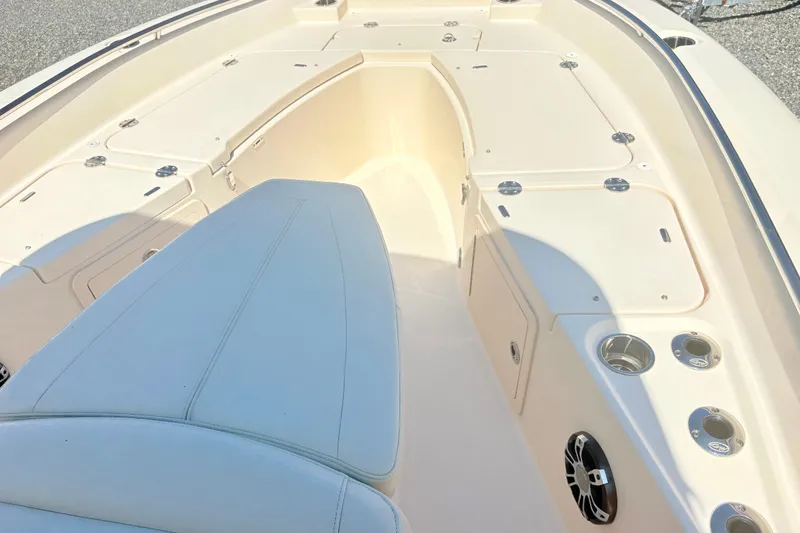 Slide: The Image of 2022 Grady-White 251 Coastal Explorer boat interior with seating and storage compartments. - 18
