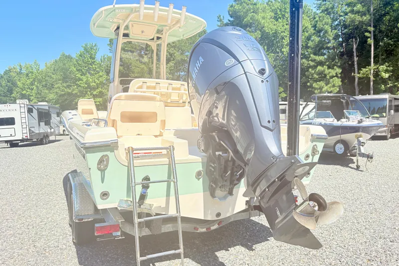 Slide: The Image of 2022 Grady-White 251 Coastal Explorer boat with Yamaha outboard motor in a sunny outdoor setting. - 20