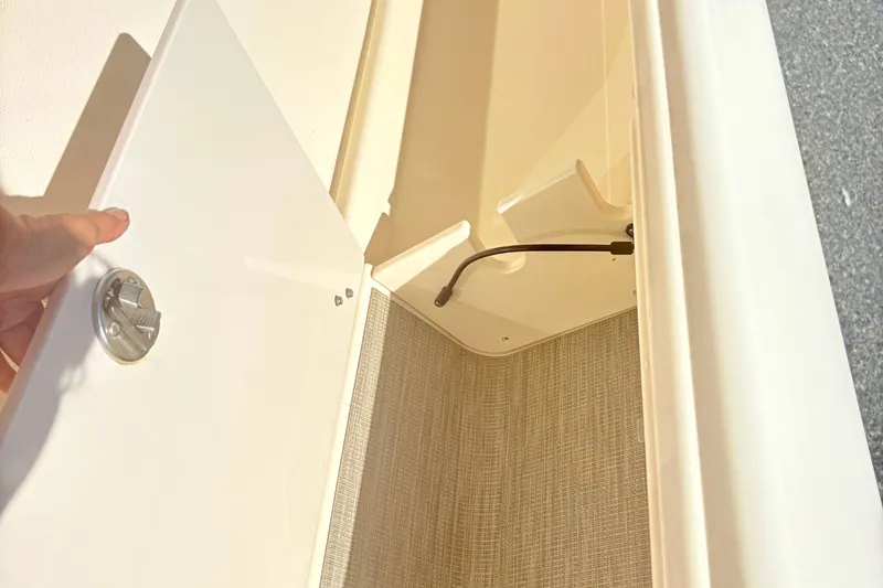 Slide: The Image of Open storage compartment on 2022 Grady-White 251 Coastal Explorer boat. - 21