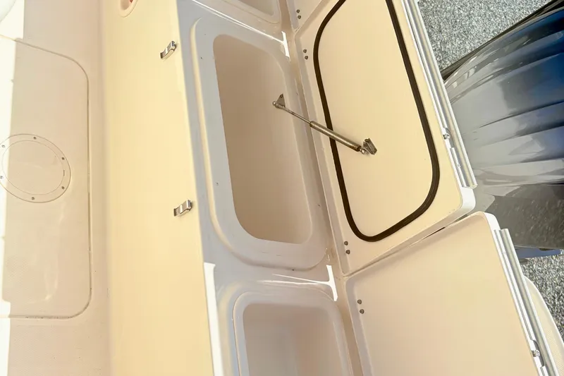Slide: The Image of 2022 Grady-White 251 Coastal Explorer storage compartments open on deck. - 22