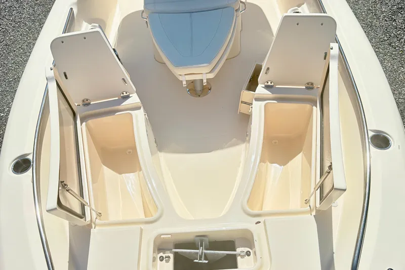Slide: The Image of 2022 Grady-White 251 Coastal Explorer boat interior with open storage compartments. - 23