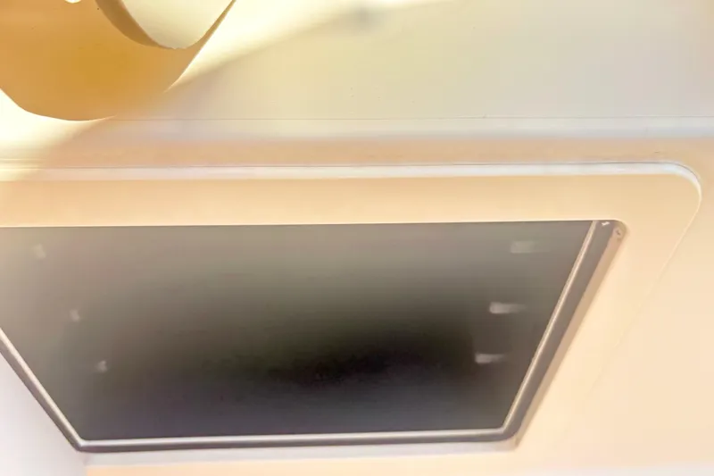 Slide: The Image of 2022 Grady-White 251 Coastal Explorer boat interior detail, featuring a hatch. - 24