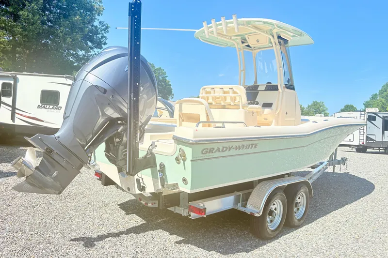 Slide: The Image of 2022 Grady-White 251 Coastal Explorer boat on trailer, parked outdoors. - 3