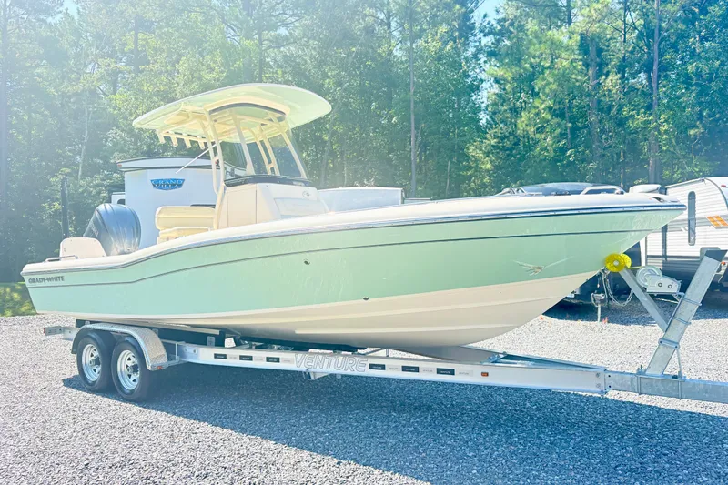 Slide: The Image of 2022 Grady-White 251 Coastal Explorer boat on trailer, parked outdoors. - 4