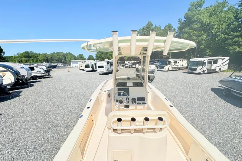 Slide: The Image of 2022 Grady-White 251 Coastal Explorer boat in a lot with RVs and trees. - 5