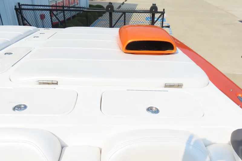 Slide: The Image of 2003 MTI 42 boat deck with orange air intake and white seating. - 13
