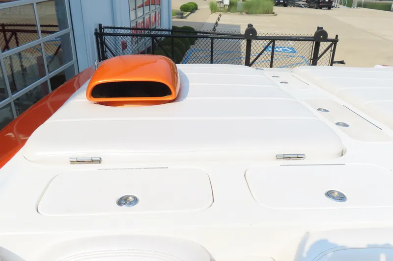 Slide: The Image of 2003 MTI 42 boat with orange air intake and white deck. - 14