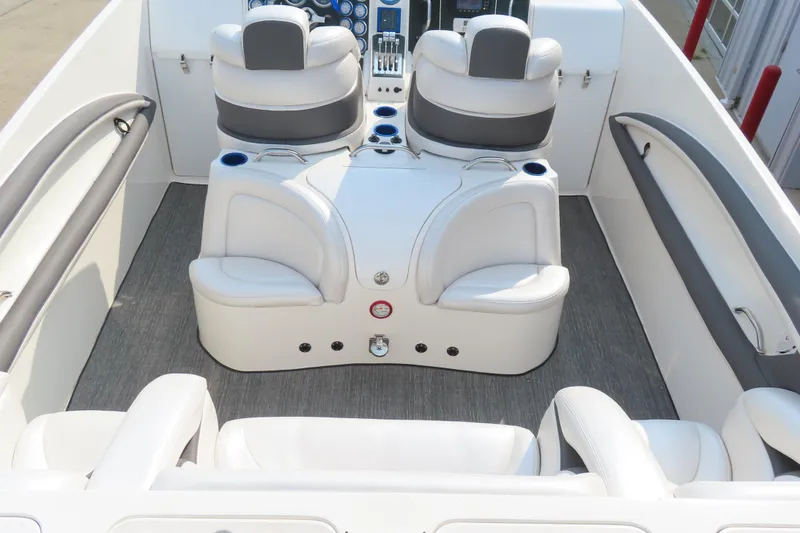 Slide: The Image of Interior of a 2003 MTI 42 boat with white and gray seating. - 15