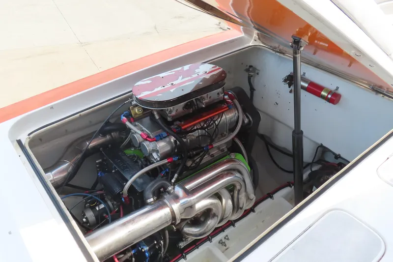 Slide: The Image of High-performance engine in a 2003 MTI 42 boat, showcasing intricate mechanical components. - 18