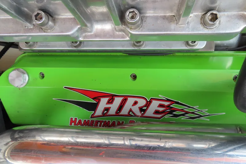 Slide: The Image of Green engine cover with "HRE Hameetman Racing" logo, MTI 42 model, 2003. - 19