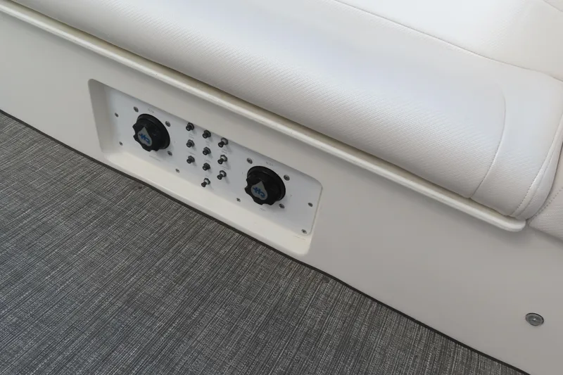 Slide: The Image of Control panel on a 2003 MTI 42 boat with white seating and gray flooring. - 21