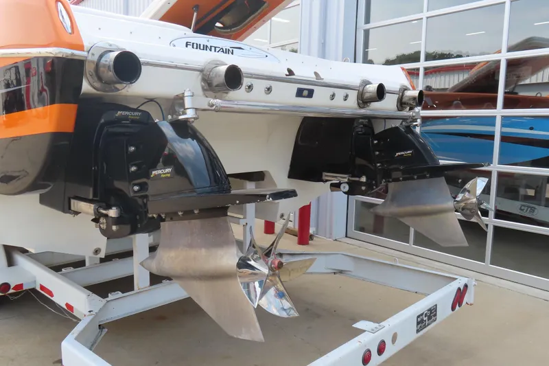Slide: The Image of Rear view of a 2003 MTI 42 boat with dual Mercury Racing engines. - 23