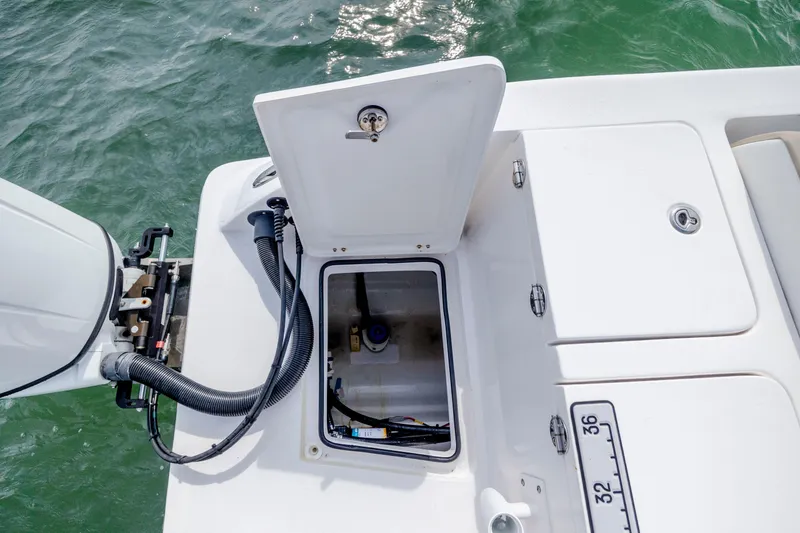 Slide: The Image of 2023 Twin Vee 240 GFX CC boat with open storage compartment on deck. - 19