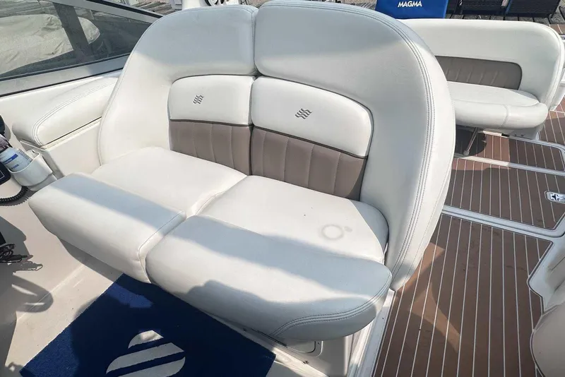 Slide: The Image of 2004 Four Winns 298 Vista boat interior with white and beige seating. - 12