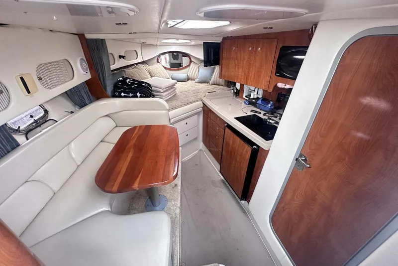 Slide: The Image of Interior of 2004 Four Winns 298 Vista boat with kitchen and seating area. - 20