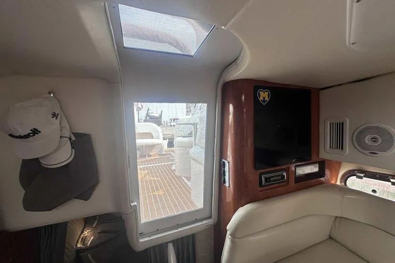 Slide: The Image of Interior of 2004 Four Winns 298 Vista boat with seating and entertainment system. - 30