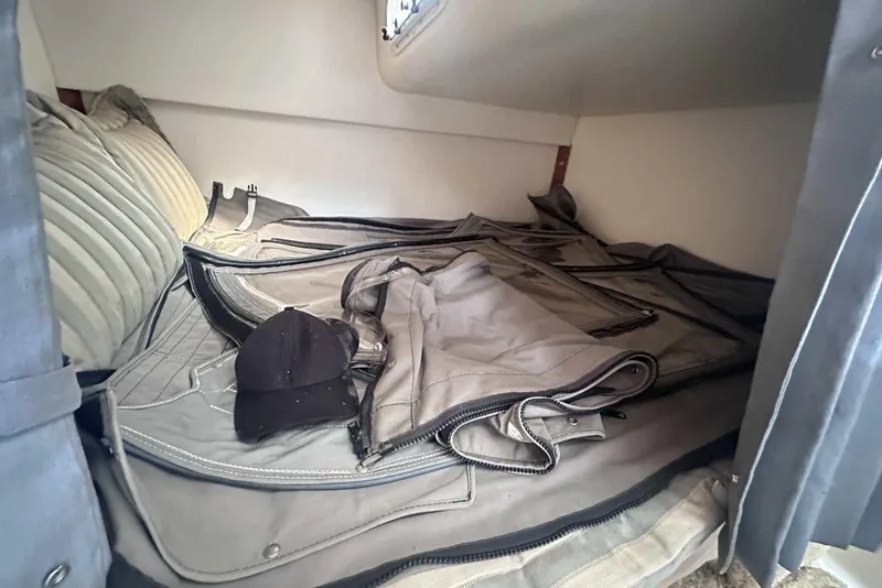 Slide: The Image of Interior cabin of 2004 Four Winns 298 Vista with cushions and folded canvas. - 32