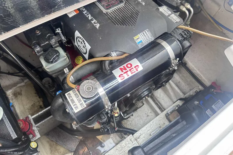 Slide: The Image of Engine compartment of a 2004 Four Winns 298 Vista boat with "No Step" label. - 38