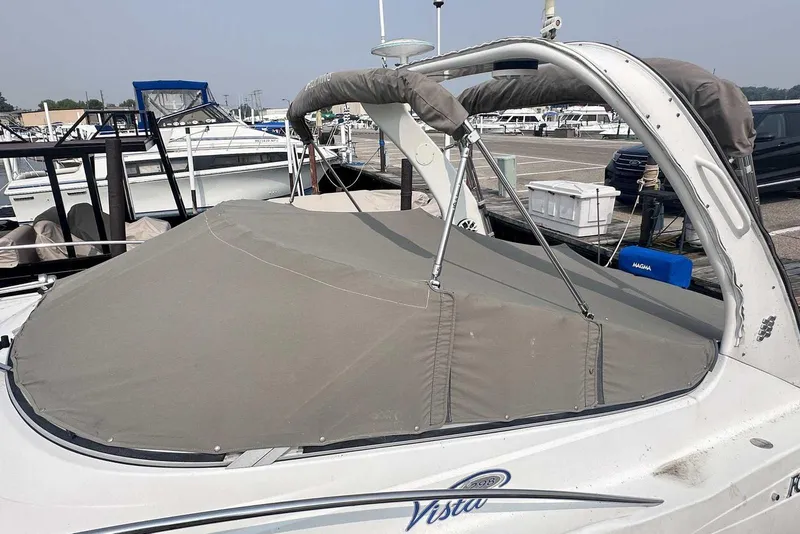 Slide: The Image of 2004 Four Winns 298 Vista boat docked with protective cover. - 4