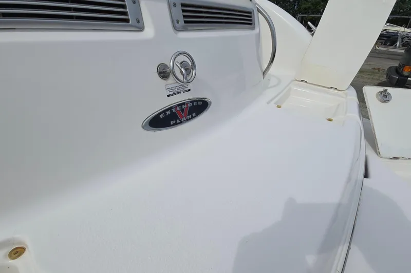 Slide: The Image of 2001 Chaparral Sunesta 233 boat with extended V-plane feature, white deck view. - 15