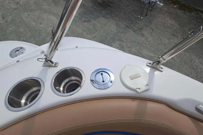 Slide: The Image of 2001 Chaparral Sunesta 233 boat deck with cup holders and fuel cap. - 17