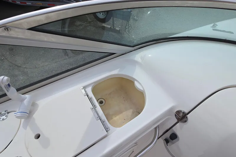 Slide: The Image of 2001 Chaparral Sunesta 233 boat interior with sink and windshield detail. - 31