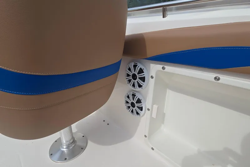 Slide: The Image of 2001 Chaparral Sunesta 233 boat interior with speakers and cushioned seating. - 33