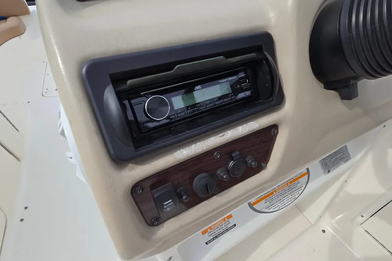 Slide: The Image of 2001 Chaparral Sunesta 233 dashboard with JVC stereo system and control panel. - 44