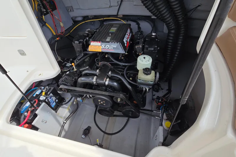 Slide: The Image of Engine compartment of 2001 Chaparral Sunesta 233 with 5.0L EFI Mercury engine. - 46