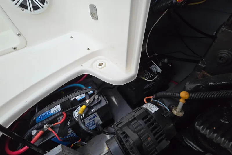 Slide: The Image of Engine compartment of a 2001 Chaparral Sunesta 233 boat, showing batteries and wiring. - 47